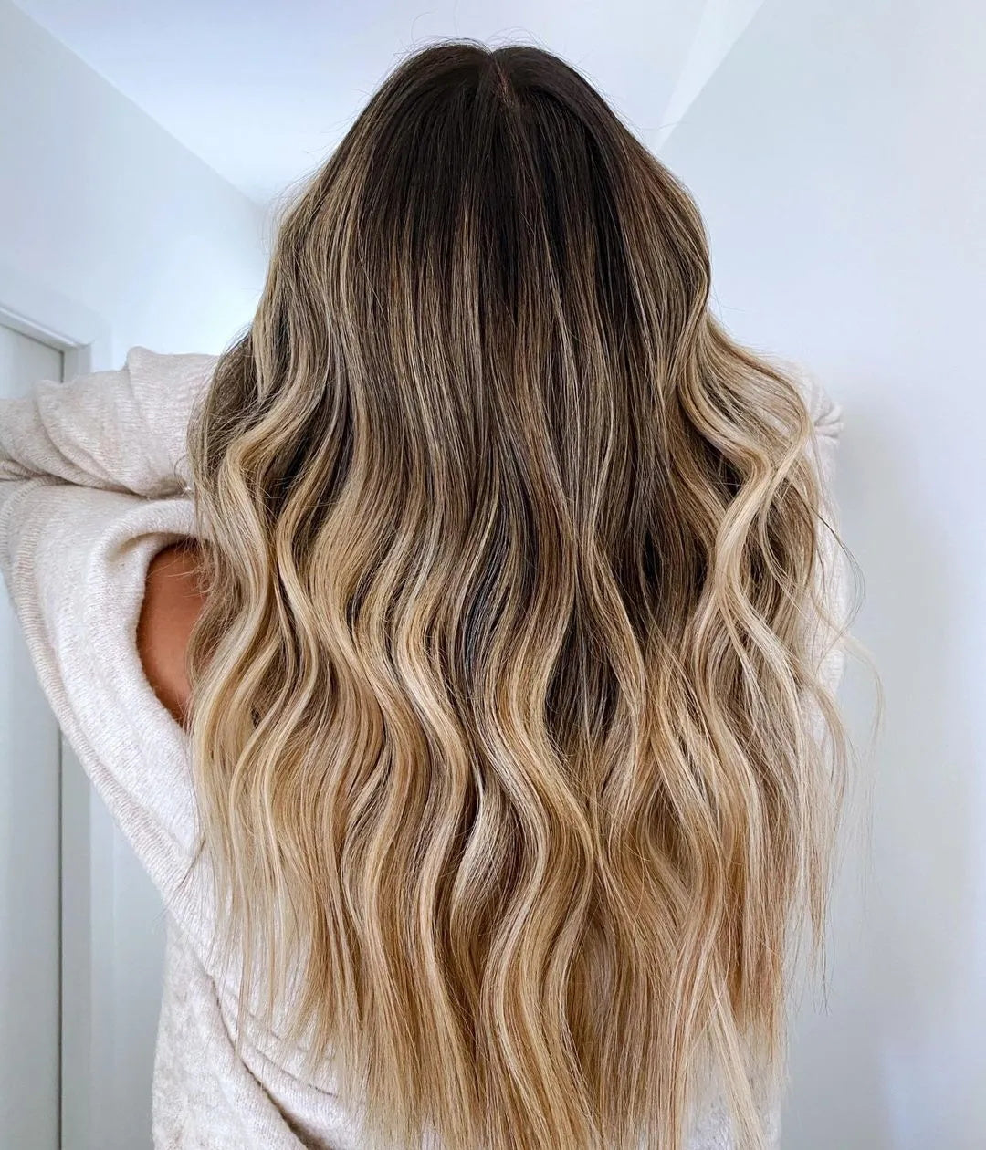 invisible tape in hair extensions balayage